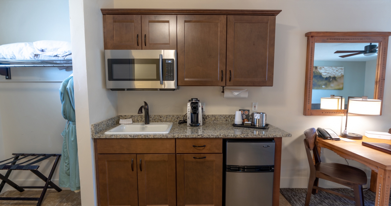 The Deluxe King kitchen with a microwave and a bar fridge