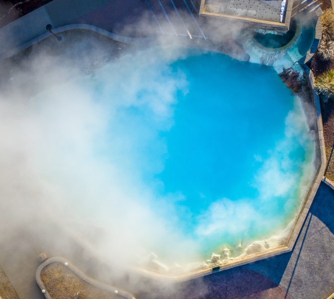 Aerial view of the steam rising from the hot spring pool