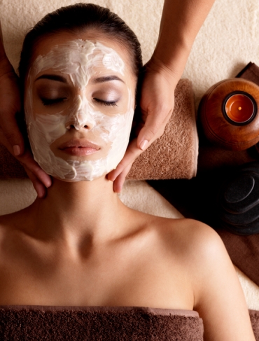 A woman receiving a facial