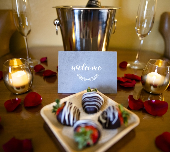 The Springs Resort welcome amenities wine and chocolate covered strawberries